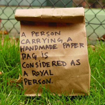 A Person Carrying a Handmade Paper Bag...